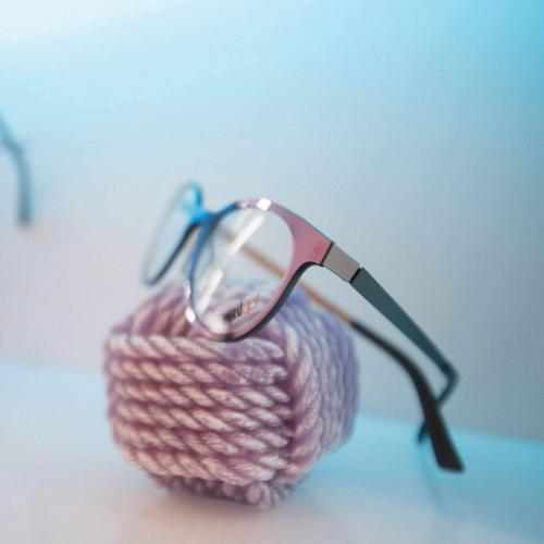 Wall eyeglasses shelf with colored RGB LED lighting.